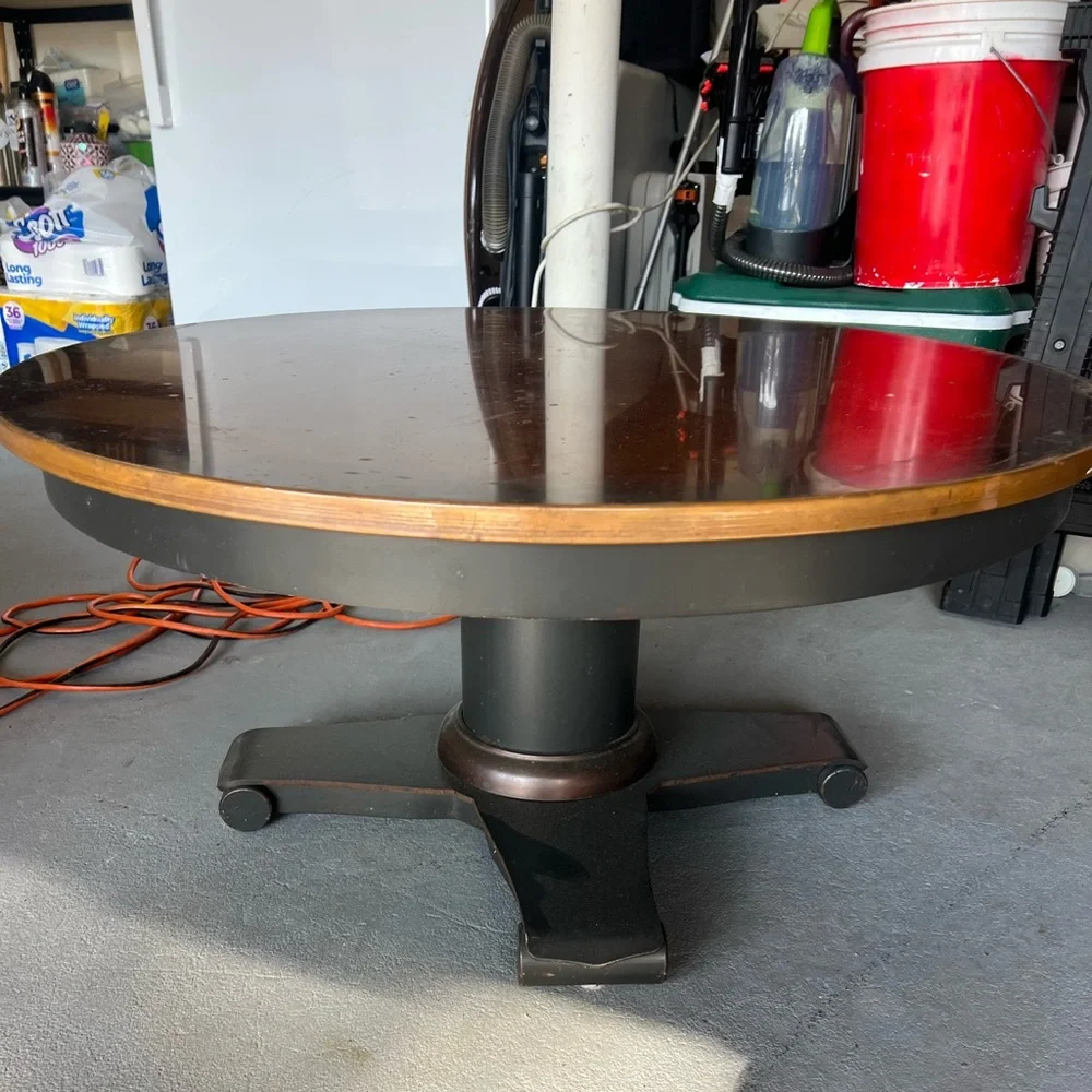Crate and Barrel 36” Round Copper Coffee Table. Pedestal base